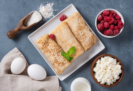 Homemade crepes with raspberry and cottage cheese