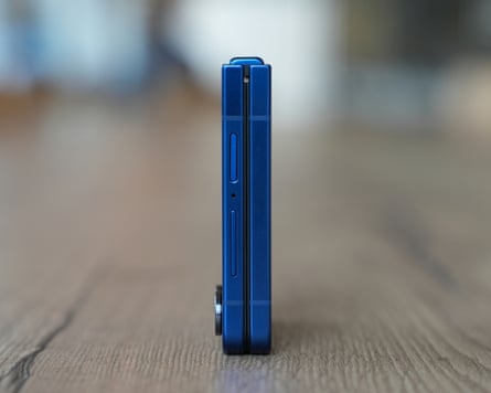 The Samsung Galaxy Z Flip 7 folded closed and stood up on its end.