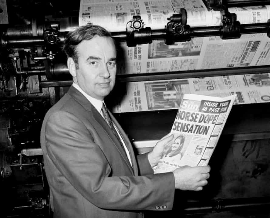 Rupert Murdoch inspects one of the first copies of the Sun in 1969