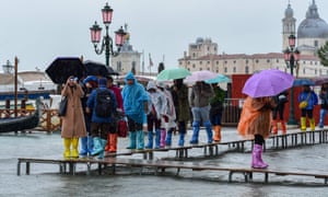 Tourists in Venice during the record acqua alta of November 2019