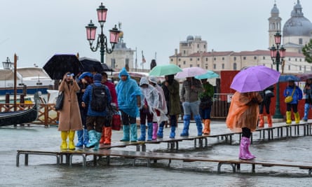 Tourists in Venice during the record acqua alta of November 2019