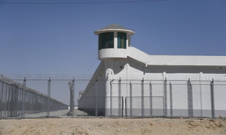 A camera is mounted on a watchtower at a high-security facility in Xinjiang, China, believed to be a re-education camp where Uyghurs are detained.