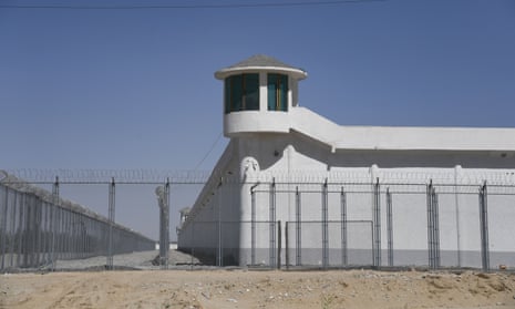 A camera is mounted on a watchtower at a high-security facility in Xinjiang, China, believed to be a re-education camp where Uyghurs are detained. 