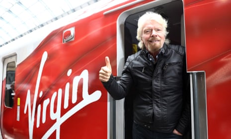 Richard Branson gives the thumbs up on a Virgin train