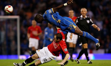 Sol Campbell and Wayne Rooney battle for possession during Manchester United’s 1-0 victory over Portsmouth at Fratton Park in August 2008