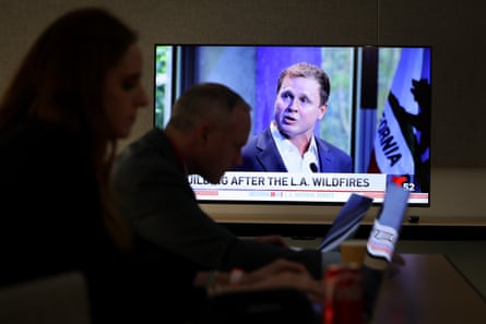 People work in front of a TV showing Spencer Pratt.