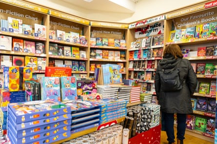 A shopper in the book section of TG Jones in Hitchin
