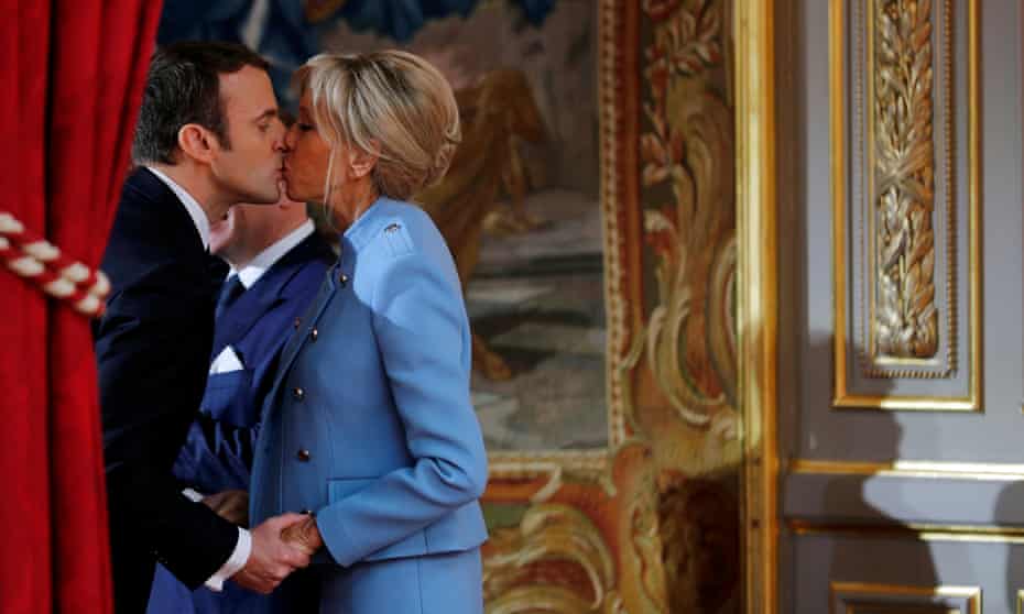 Macron and his wife, Brigitte,  at the handover ceremony in May