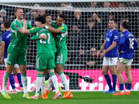 Dan Burn, Tino Livramento, Lewis Miley and Malick Thiaw celebrate Newcastle United’s second goal at Everton, scored by Miley.
