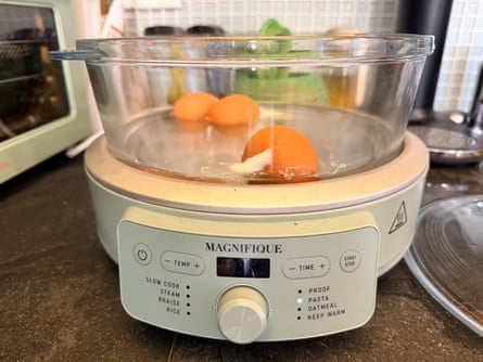 eggs inside basket of multicooker in kitchen