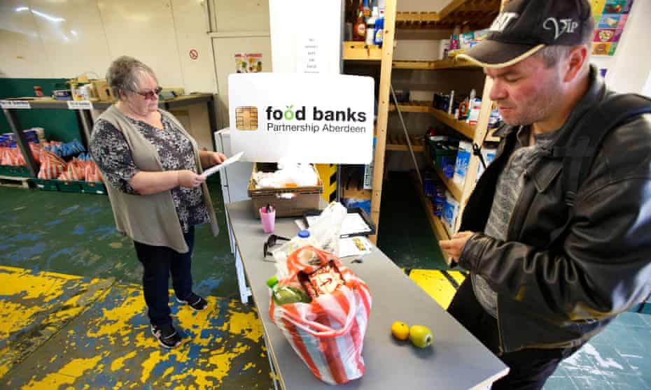 A man visits a food bank in Aberdeen. More than a fifth of the UK’s population live in poverty