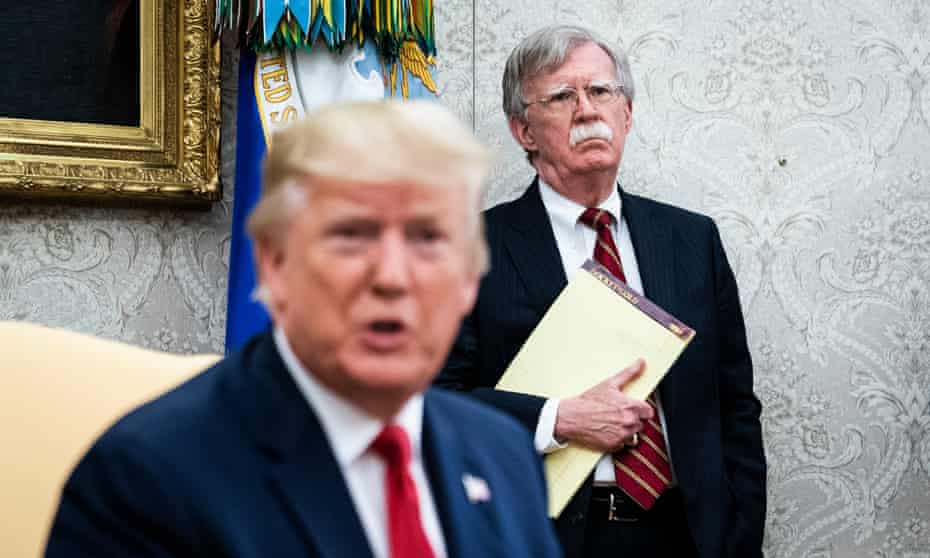 Trump with John Bolton in July 2019. Bolton said the pair discussed how burner phones were deployed by people as a way of avoiding scrutiny of their calls.
