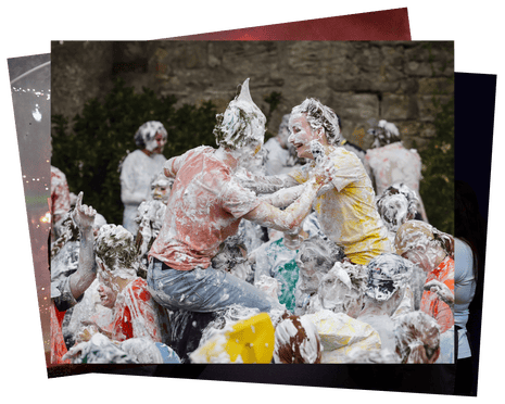 Young people covered in foam appear to be having fun