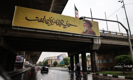 A banner bearing a picture of Hassan Nasrallah with the slogan ‘Hezbollah is alive’, in northern Tehran on 28 September.