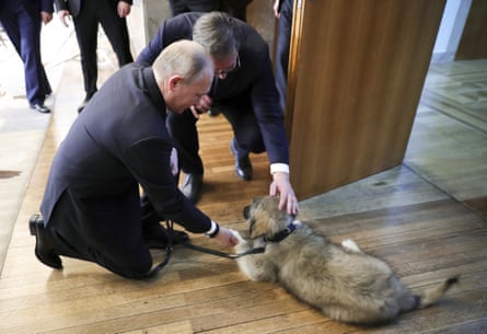 Aleksandar Vučic presents Vladimir Putin with a puppy in Belgrade on Thursday.