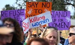People attend a rally to a call for action to end violence against women, in Canberra, Australia 