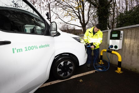 A BT Openreach van being charged
