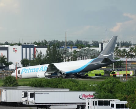 The damaged plane sits on the runway