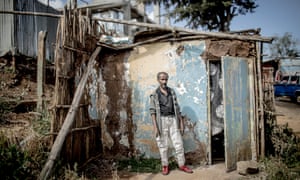 Selhadin Sulman by his makeshift home, which was pulled down just a few days after this photo was taken.