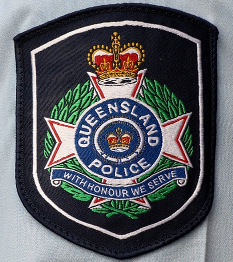 Photograph of a badge on the arm of a Queensland police officer