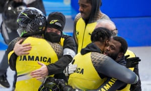 Jamaican bobsledders embrace after their final run.