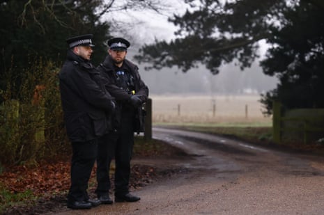 Police officers outside Wood Farm