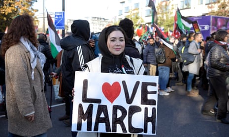 A woman holds a ‘Love march’ sign at London’s pro-Palestine rally