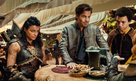 three people around a table in medieval gear