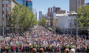 Protesters take part in a rally in Melbourne, Australia, to protest against the Trump Inauguration.