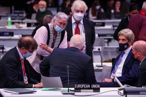 Delegates including the US special envoy for climate, John Kerry (second right) cluster Frans Timmermans (centre), the first vice president of the European Commission