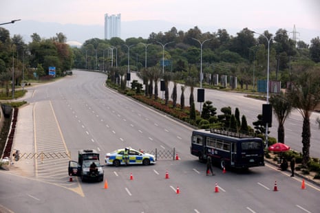 A police car blocks a road.