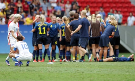 Megan Rapinoe consoles Carli Lloyd after defeat to Sweden in the Olympic quarter-final.