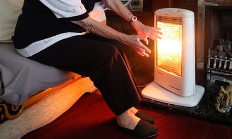 An elderly woman uses an electric heater to keep warm. Flammable furniture and drying clothes should be placed away from heaters and fires.
