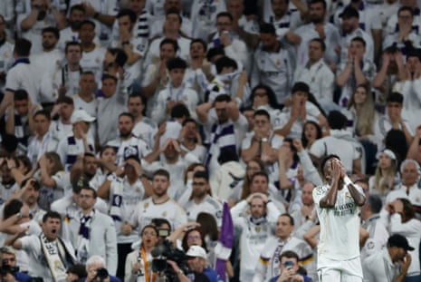 Real Madrid's Vinicius Junior reacts after firing a shot wide.