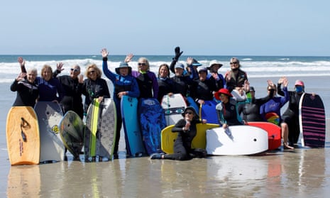 Senior women gather to boogie board on International Women's Day in Solana Beach, California.