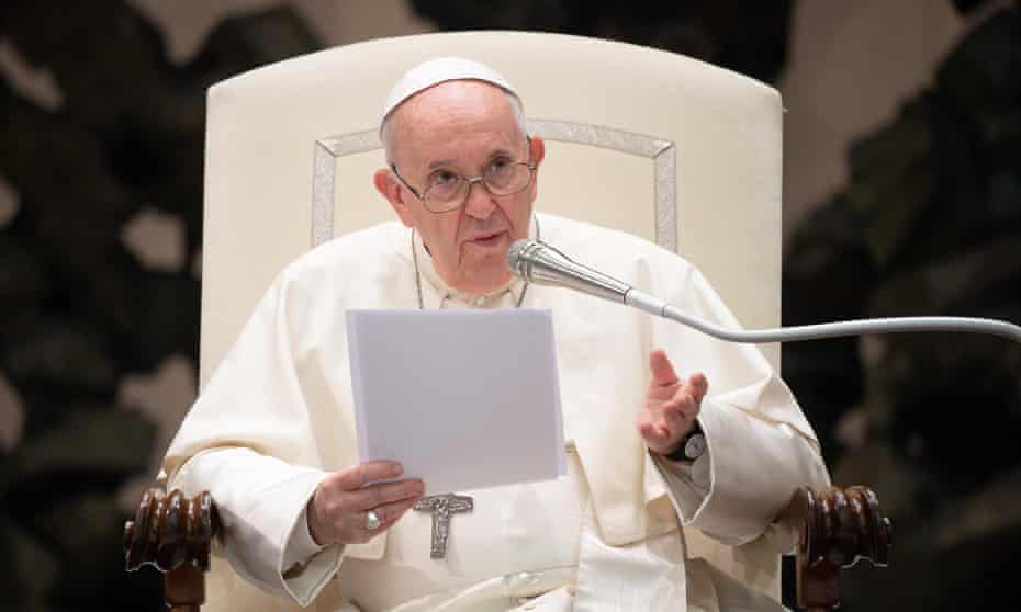 Pope Francis in chair with microphone