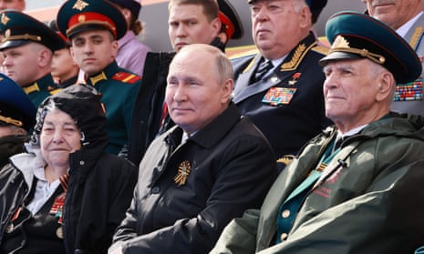 Vladimir Putin watches the Victory Day military parade in Moscow’s Red Square