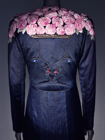Back of coat with pink flowers over shoulder and face in back