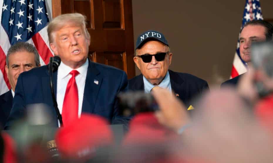 Trump and Giuliani at the president’s golf club in New Jersey in August. Presidential pardons are a common feature of the waning days of any White House term.