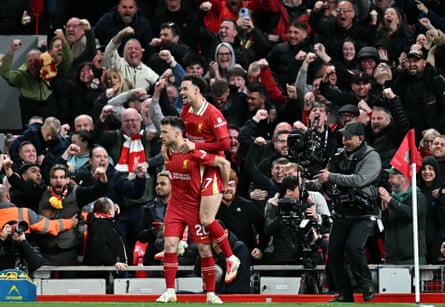 Diogo Jota takes in the acclaim of teammate Curtis Jones and a jubilant home crowd after scoring the crucial goal in a 1-0 victory over Everton at Anfield in April