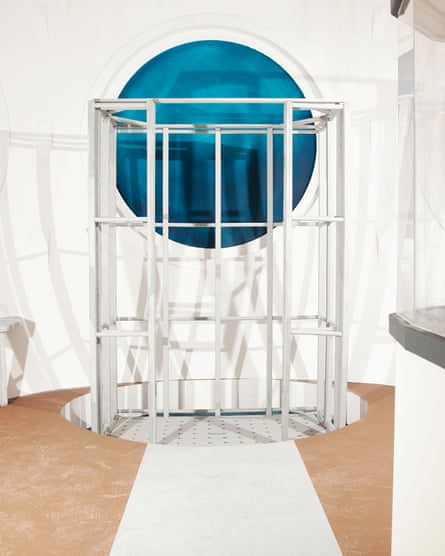 A metal lift in front of a porthole