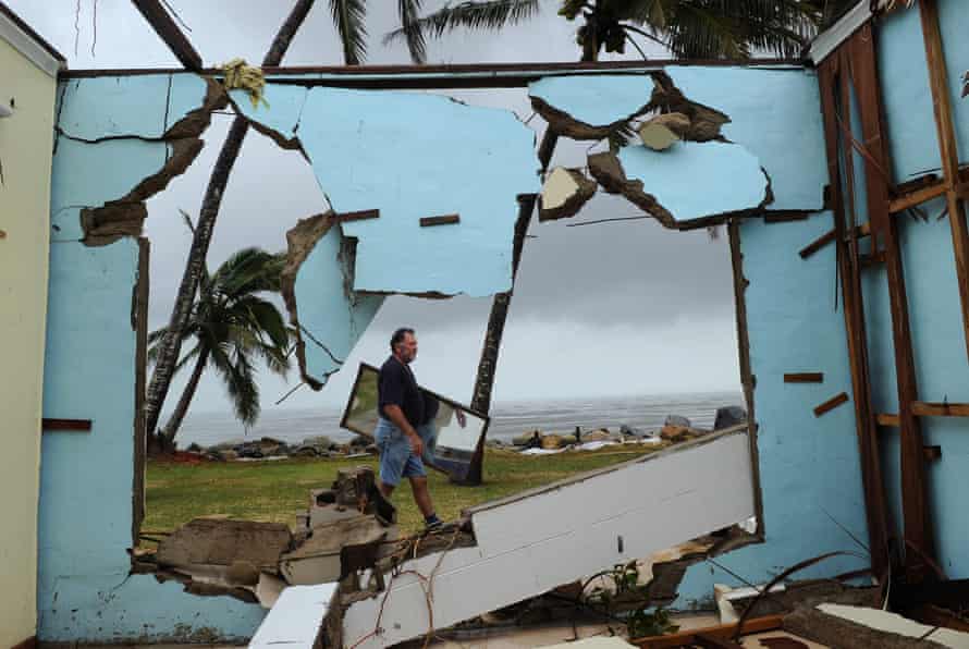 Greville Blank scours for possessions around his destroyed home following the devastating Cyclone Yasi in Tully Heads, north Queensland, in February 2011.