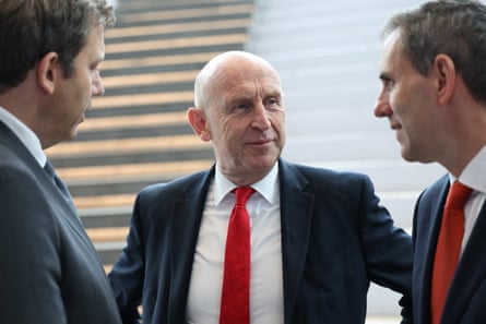 Lars Klingbeil, John Healey and Jim Chalmers converse closely