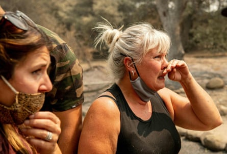 Katie Giannuzzi reacts as she and her family see the burned remains of their home during the LNU Lightning Complex fire in Vacaville, California.