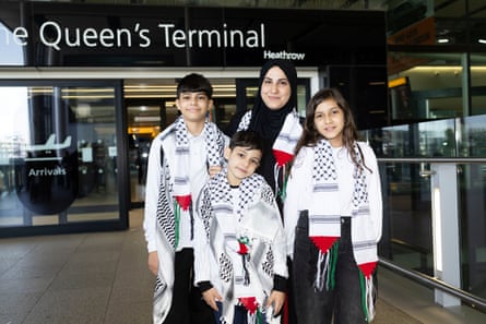 Mariam with her mother and two brothers outside Heathrow.