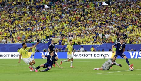 Matheus Cunha scores their third for Brazil past Angus Gunn.