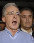 Álvaro Uribe, pictured in 2016 with Iván Duque, presents a more grandfatherly image than when in office.