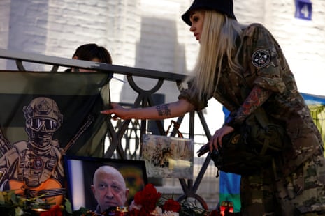 A woman visits a makeshift memorial with a portrait of Wagner mercenary chief Yevgeny Prigozhin in Moscow, Russia August 24, 2023.