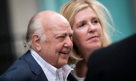 Roger Ailes walks with his wife Elizabeth Tilson as they leave the News Corp building in New York City on Tuesday.