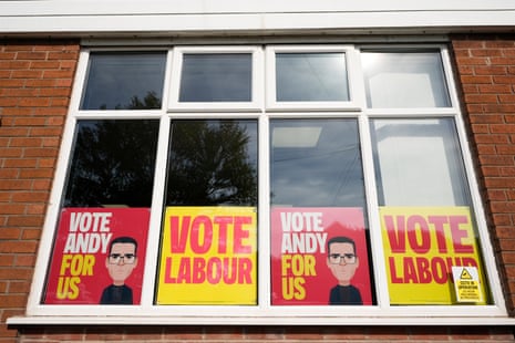 Election campaign posters in the window of Stubshaw Cross Community and Sports Club in Ashton-in-Makerfield.